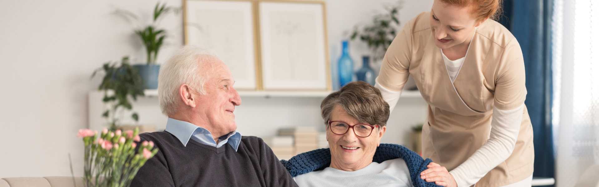 senior couple with caretaker