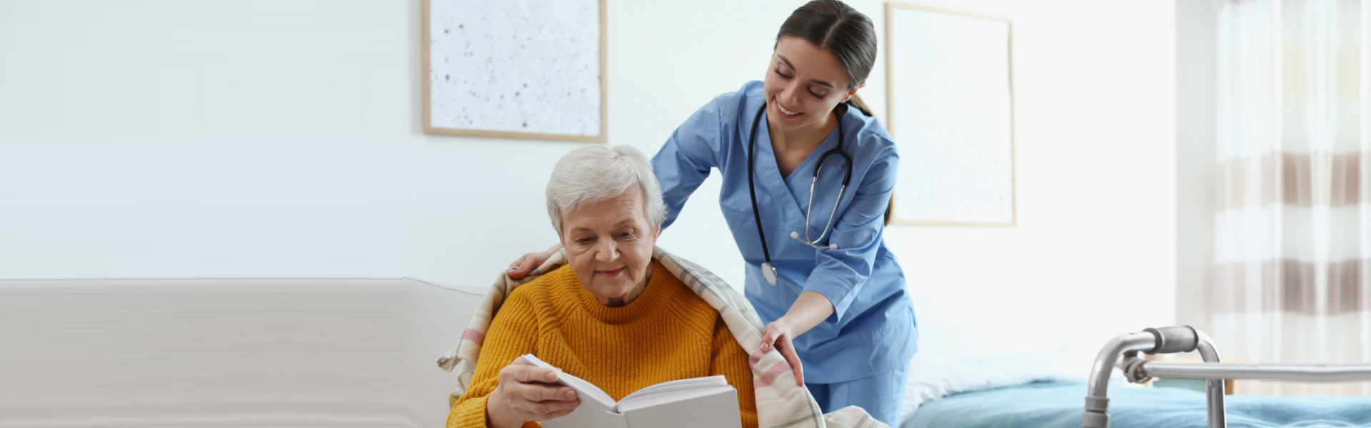 woman reading book assisted by the staff